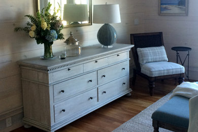 This is an example of a medium sized classic master bedroom in Grand Rapids with beige walls, light hardwood flooring, no fireplace and beige floors.