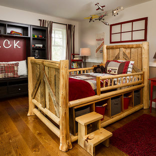 Mid-sized cottage medium tone wood floor bedroom photo in Minneapolis with brown walls
