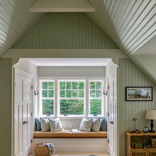 Arts and crafts bedroom in Boston with green walls, carpet and beige floor.