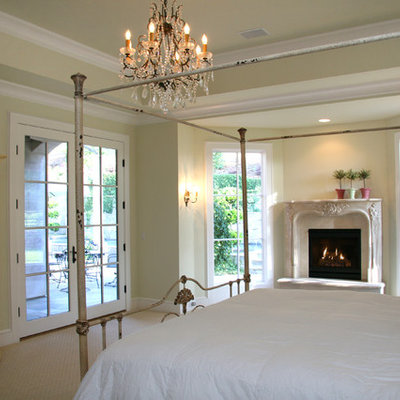 Bedroom - rustic bedroom idea in Sacramento with a standard fireplace