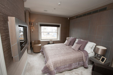 Photo of a medium sized contemporary guest and grey and silver bedroom in Berkshire with grey walls, carpet and no fireplace.