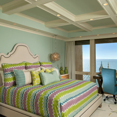 Example of an island style light wood floor bedroom design in New York with blue walls