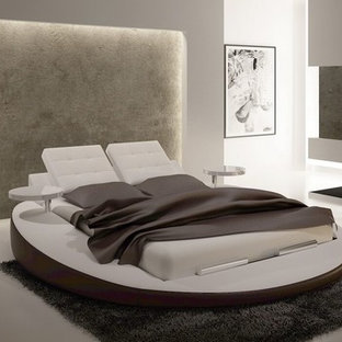 Inspiration for a large modern master bedroom in Toronto with white walls, marble floors, no fireplace and beige floor.