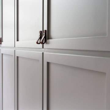 Leather pull handles on shaker wardrobe