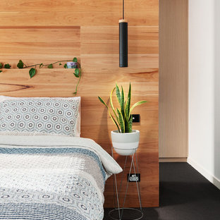 Diseño de dormitorio contemporáneo, sin chimenea, con paredes blancas, moqueta y suelo negro