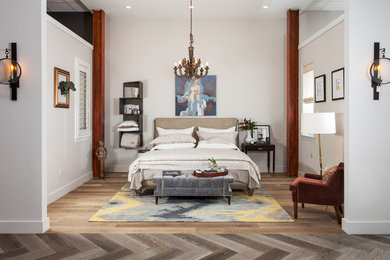 Bedroom - mid-sized transitional master light wood floor and brown floor bedroom idea in Tampa with beige walls and no fireplace