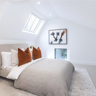 Medium sized classic master bedroom in London with white walls, carpet and grey floors.