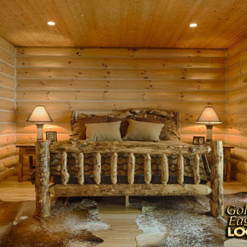 Log walls in a bedroom suite
