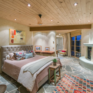 Bedroom - southwestern bedroom idea in San Francisco with beige walls and a corner fireplace