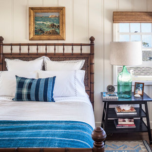 Inspiration for a small coastal dark wood floor bedroom remodel in Orange County with white walls