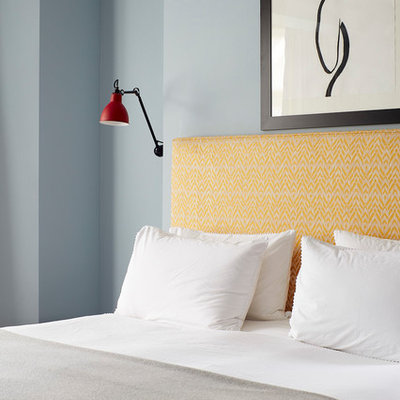 Trendy bedroom photo in London with blue walls
