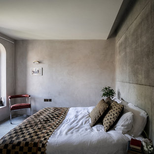 Inspiration for a mediterranean master bedroom in London with grey walls, concrete flooring and grey floors.