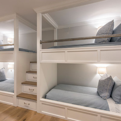 Large beach style guest medium tone wood floor bedroom photo in Boston