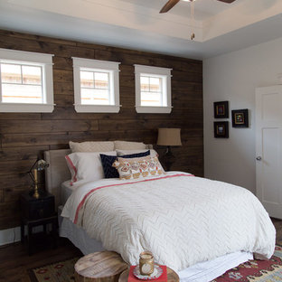 This is an example of a traditional bedroom in Dallas with medium hardwood flooring.