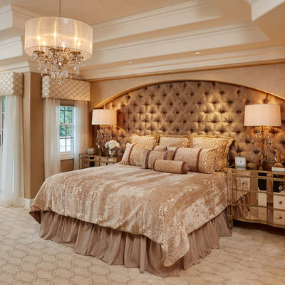Inspiration for a large transitional master carpeted bedroom remodel in New York with beige walls, a standard fireplace and a stone fireplace