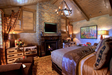 Classic master bedroom in Denver with brown walls, a standard fireplace and a wooden fireplace surround.