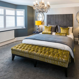 This is an example of a medium sized contemporary bedroom in Kent with grey walls, carpet and grey floors.