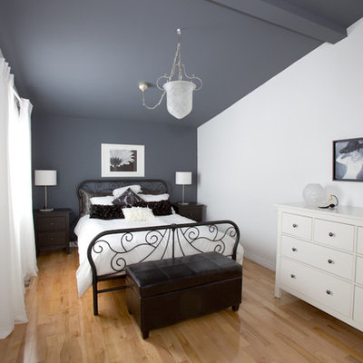 Trendy light wood floor bedroom photo in Montreal with gray walls