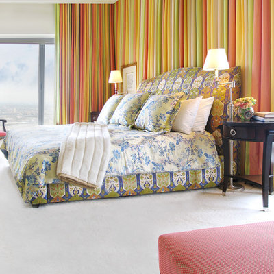 Inspiration for an eclectic bedroom remodel in Chicago with white walls