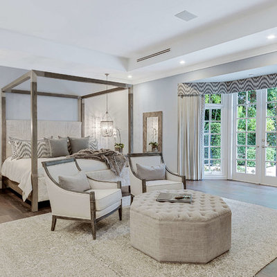 Inspiration for a transitional master dark wood floor and brown floor bedroom remodel in Miami with gray walls