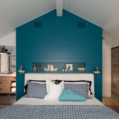 Mid-sized beach style master medium tone wood floor bedroom photo in San Diego with white walls and no fireplace