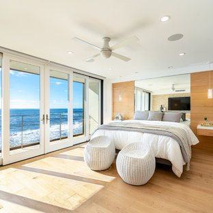 Inspiration for a huge contemporary master light wood floor and yellow floor bedroom remodel in Los Angeles with white walls