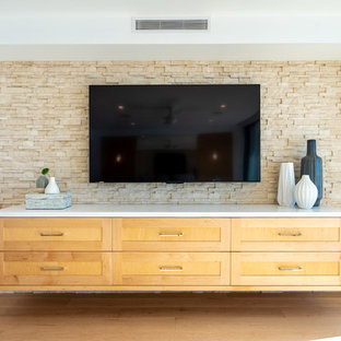 Huge trendy master light wood floor and yellow floor bedroom photo in Los Angeles with white walls