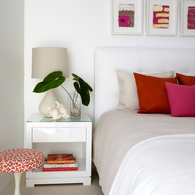 Beach style carpeted bedroom photo in Los Angeles with white walls