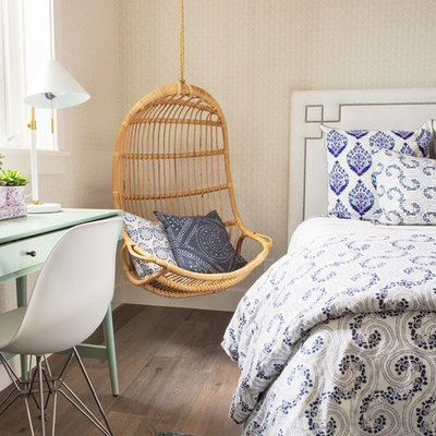 Inspiration for a coastal dark wood floor and brown floor bedroom remodel in Los Angeles with beige walls and no fireplace
