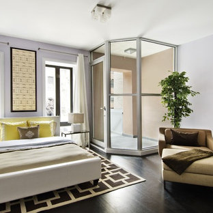 Imagen de dormitorio moderno con paredes blancas y suelo negro