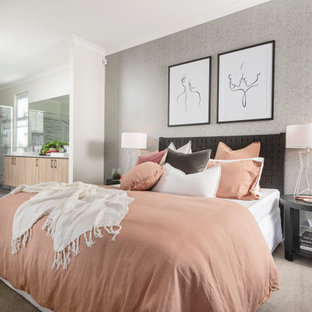 Photo of a contemporary master bedroom in Perth with white walls, carpet, no fireplace and beige floor.