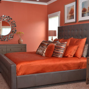Imagen de dormitorio principal, bohemio, grande, sin chimenea, con parades naranjas, moqueta y suelo gris
