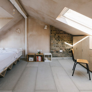 Inspiration for a scandinavian guest bedroom in London with beige walls, light hardwood flooring, no fireplace and beige floors.