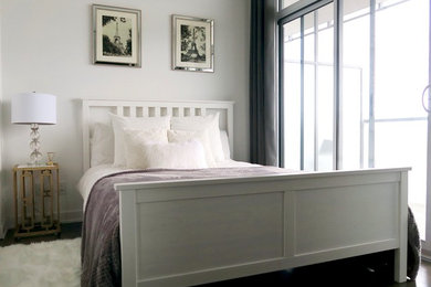 Inspiration for a small transitional master dark wood floor bedroom remodel in Toronto with white walls and no fireplace