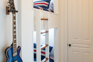 Inspiration for a small classic guest bedroom in Charleston with white walls, dark hardwood flooring and brown floors.