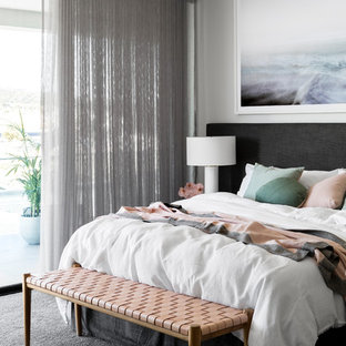 Inspiration for a contemporary master bedroom in Melbourne with white walls, carpet and grey floor.