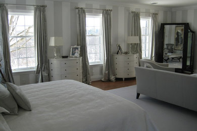 Example of a classic master bedroom design in Other with no fireplace
