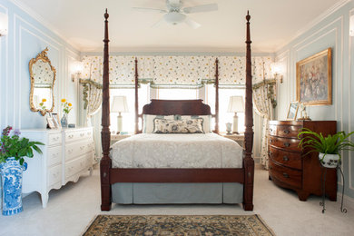 Example of a mid-sized classic master carpeted and white floor bedroom design in Other with blue walls and no fireplace
