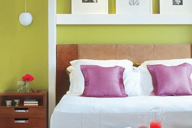 Bedroom - small contemporary master medium tone wood floor bedroom idea in Other with multicolored walls