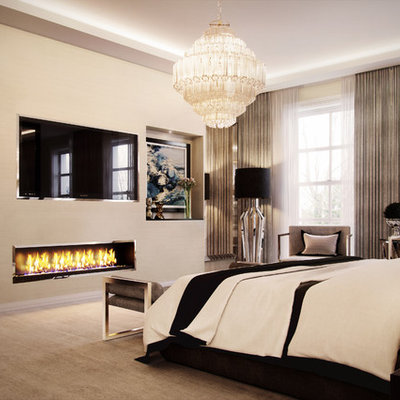 Example of a trendy master carpeted and beige floor bedroom design in West Midlands with beige walls and a ribbon fireplace