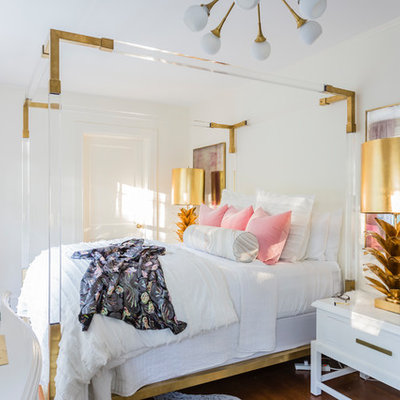Bedroom - eclectic medium tone wood floor and brown floor bedroom idea in Raleigh with white walls
