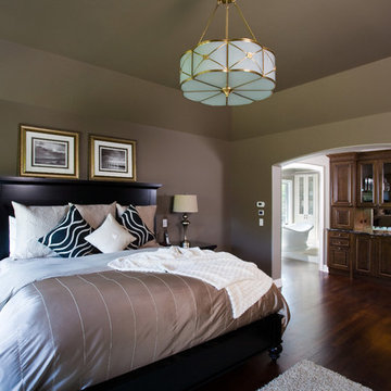 Master Bedroom featuring Acacia Hardwood Flooring and Tray Ceiling