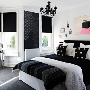 This is an example of a medium sized classic master bedroom in Other with grey walls, carpet, a standard fireplace and grey floors.