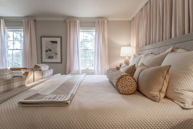 Example of a large transitional master bedroom design in Little Rock with beige walls