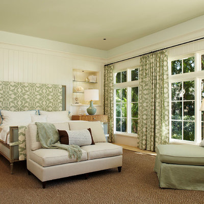Example of a large classic master beige floor and light wood floor bedroom design in Miami with beige walls and no fireplace