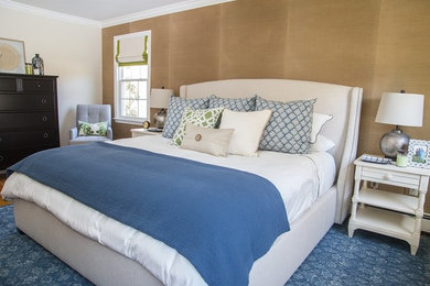 Medium sized classic master bedroom in New York with beige walls and medium hardwood flooring.