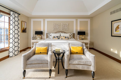 Example of a large transitional master carpeted, beige floor, vaulted ceiling and wall paneling bedroom design in Other with beige walls and no fireplace