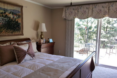 Bedroom - mid-sized traditional master carpeted bedroom idea in Orange County with beige walls