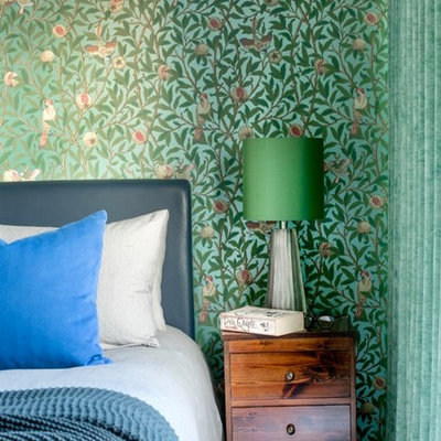 Mid-sized transitional master carpeted and gray floor bedroom photo in London with multicolored walls