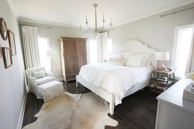 Inspiration for a mid-sized transitional master dark wood floor bedroom remodel in Austin with gray walls